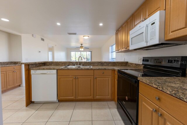 kitchen featuring ceiling fan, light tile patterned flooring, white appliances, and sink