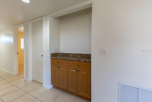 interior space with light tile patterned floors