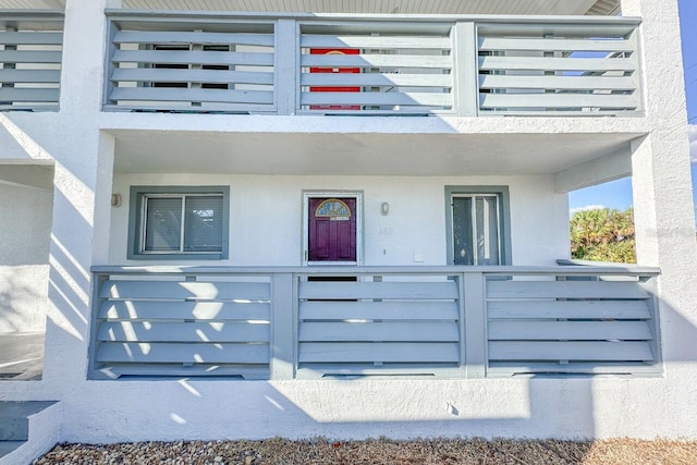 doorway to property featuring a balcony