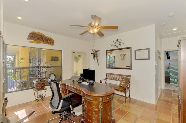 tiled office space featuring ceiling fan