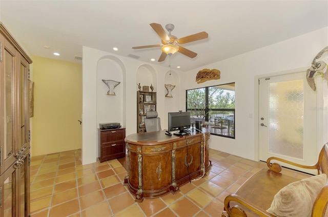 tiled office space with ceiling fan