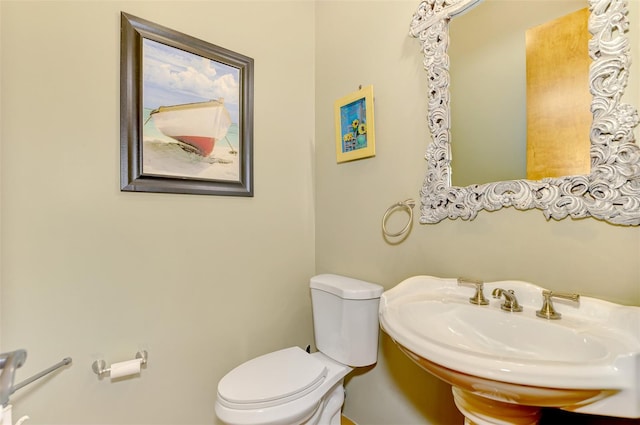 bathroom with toilet and sink