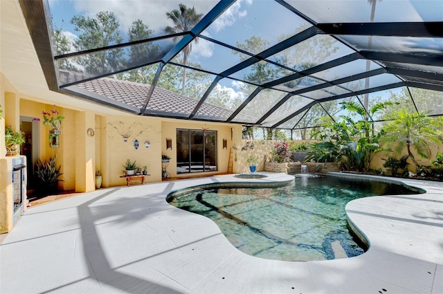 view of swimming pool with glass enclosure and a patio area