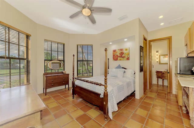 tiled bedroom with ceiling fan