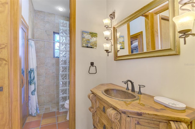 bathroom featuring tile patterned floors, vanity, toilet, and curtained shower