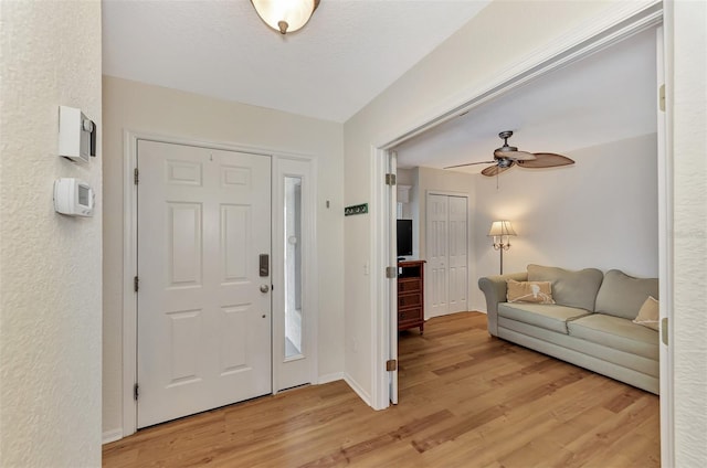 entrance foyer featuring light hardwood / wood-style floors and ceiling fan