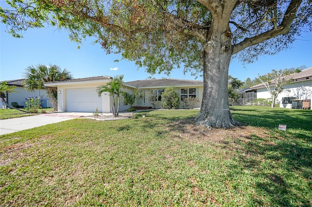 single story home with a front yard and a garage