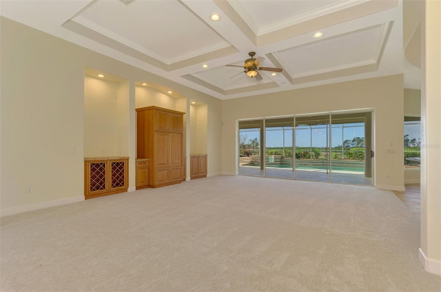 unfurnished living room with ornamental molding, light colored carpet, ceiling fan, and coffered ceiling