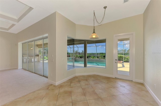 unfurnished dining area with light carpet