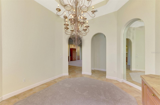 empty room with a notable chandelier