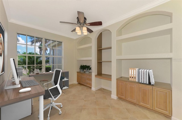 tiled office space with built in shelves, ceiling fan, and crown molding