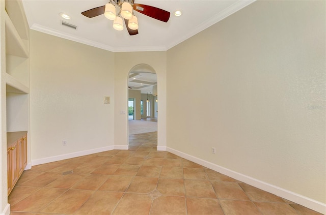 unfurnished room featuring light tile patterned floors, ceiling fan, and ornamental molding