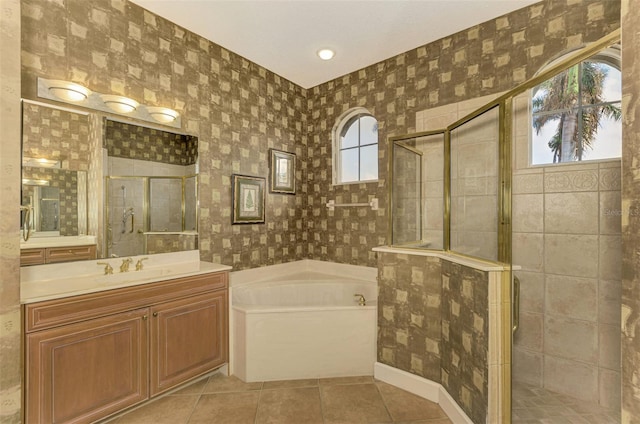 bathroom featuring shower with separate bathtub, vanity, tile patterned floors, and a healthy amount of sunlight