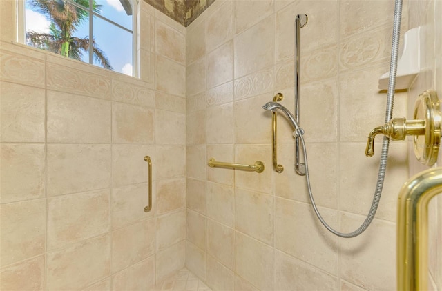 bathroom with a tile shower