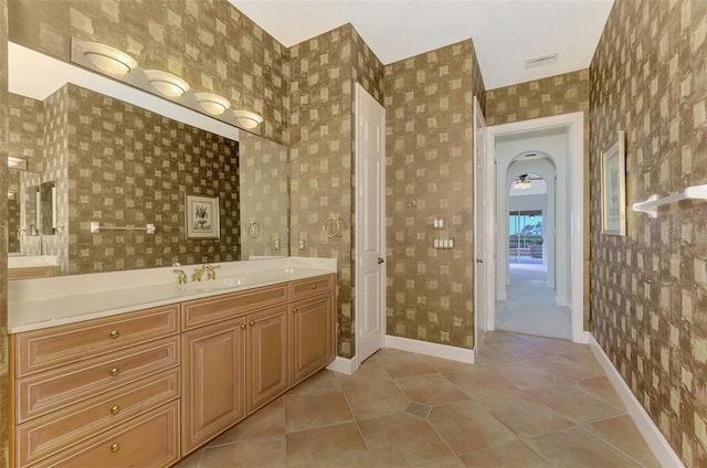 bathroom with tile patterned flooring and vanity