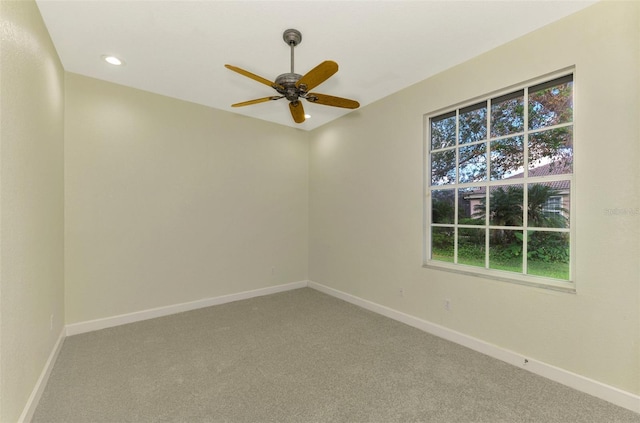 empty room with carpet floors and ceiling fan