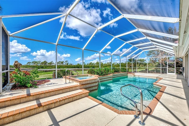 view of swimming pool with glass enclosure, an in ground hot tub, and a patio