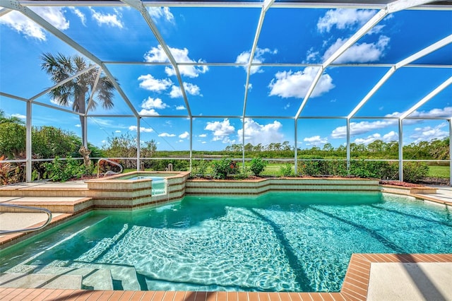 view of swimming pool with glass enclosure and an in ground hot tub