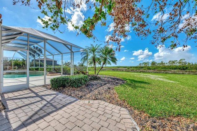 view of patio featuring a lanai