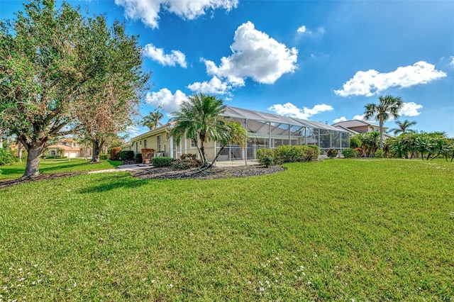 view of yard featuring glass enclosure