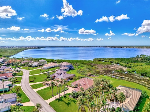 birds eye view of property with a water view