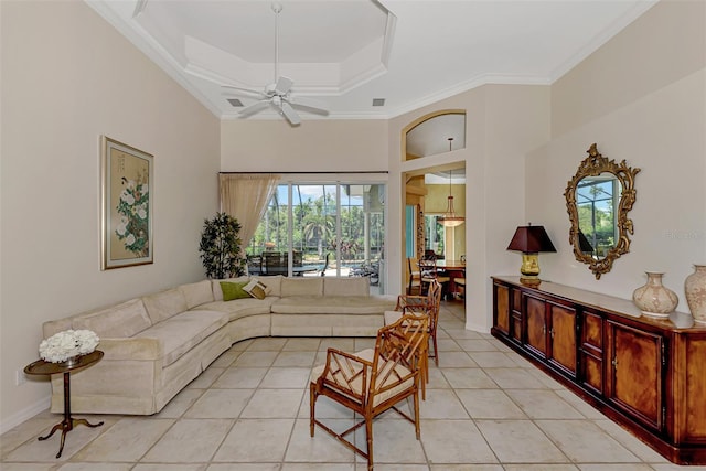 living room with ceiling fan, crown molding, and light tile patterned floors