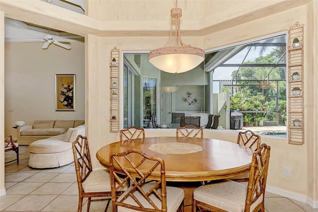 tiled dining area featuring ceiling fan