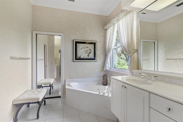 bathroom with tile patterned floors, a bathtub, ornamental molding, and vanity