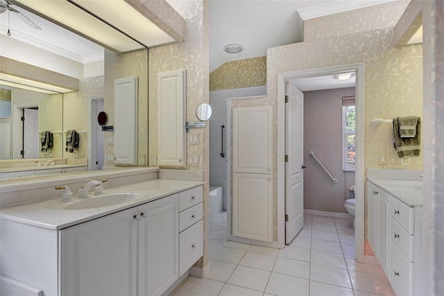 bathroom featuring toilet, vanity, tile patterned floors, and ceiling fan