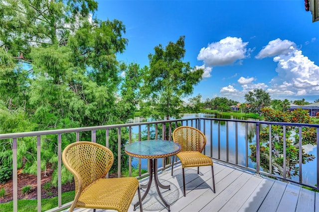 wooden deck with a water view