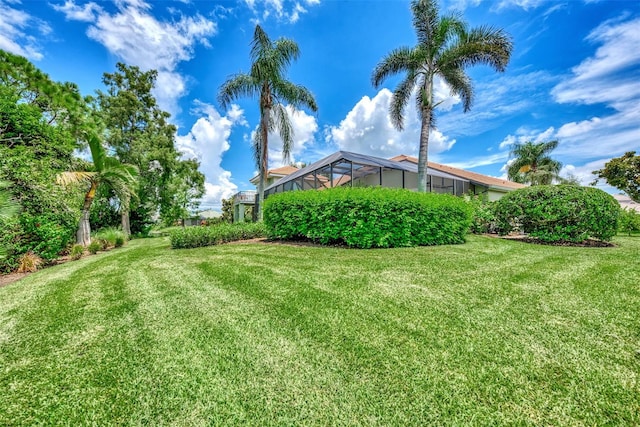 view of yard featuring a lanai