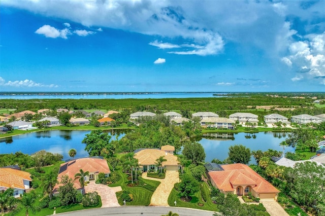 drone / aerial view with a water view