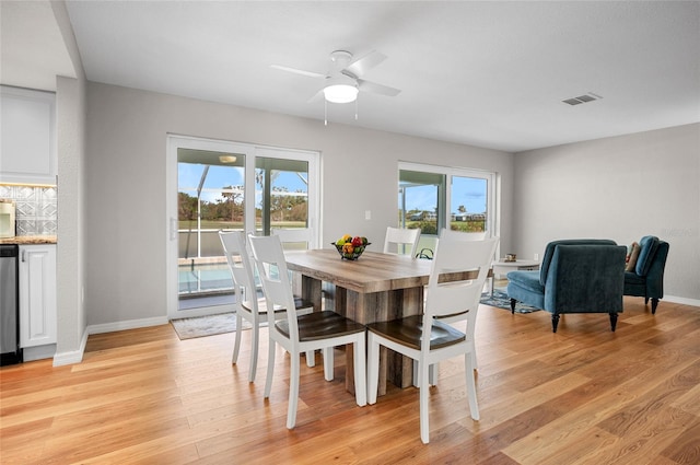 dining space featuring ceiling fan and light hardwood / wood-style floors