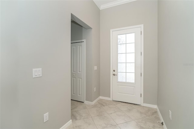 doorway featuring light tile patterned floors and crown molding