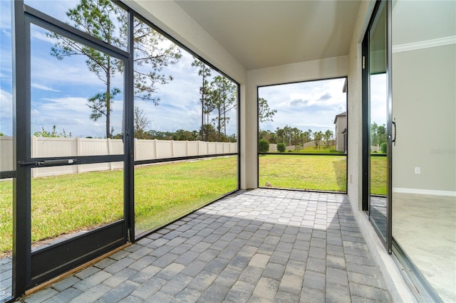 unfurnished sunroom with a wealth of natural light