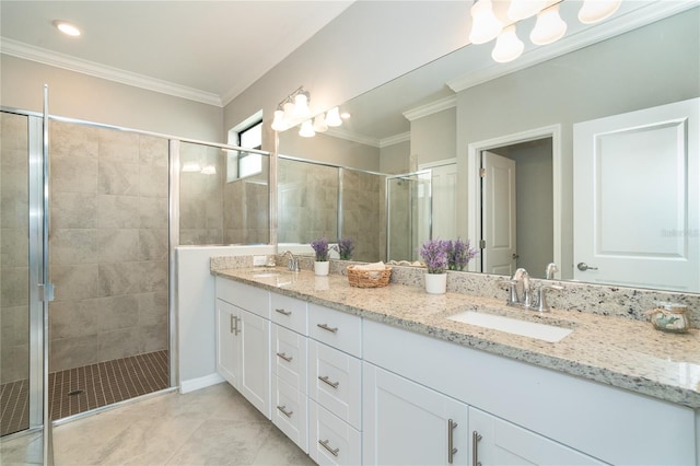 bathroom with a shower with shower door, vanity, tile patterned flooring, and ornamental molding