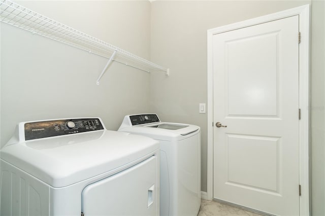 laundry room with separate washer and dryer