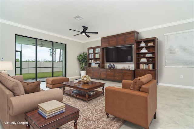 living area with visible vents, baseboards, crown molding, and a ceiling fan