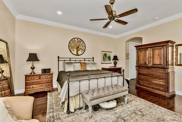 bedroom with ornamental molding, dark hardwood / wood-style floors, and ceiling fan