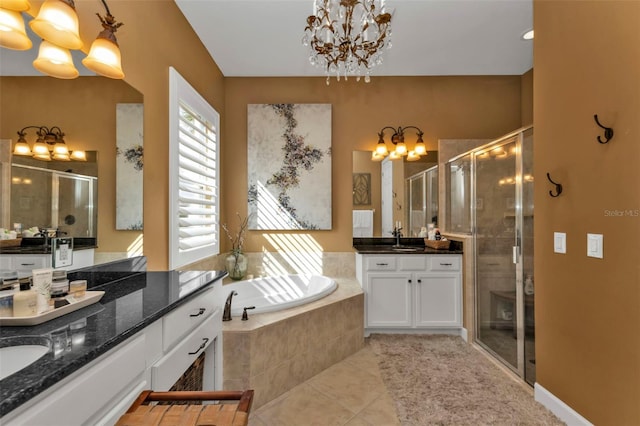 bathroom with independent shower and bath, tile patterned flooring, vanity, and an inviting chandelier