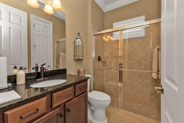 bathroom with toilet, tile patterned floors, a shower with door, vanity, and crown molding