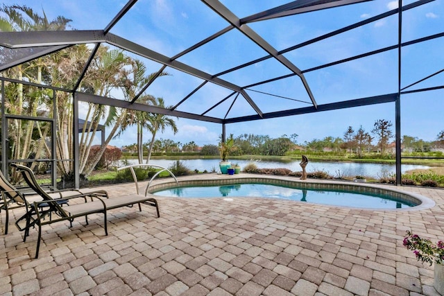 view of swimming pool with a lanai, a water view, and a patio