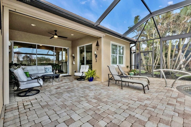 sunroom featuring a healthy amount of sunlight and ceiling fan