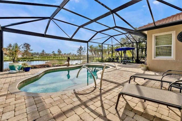 view of swimming pool with a water view, glass enclosure, and a patio area