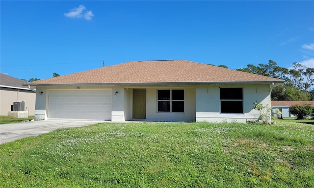 ranch-style house featuring a garage and a front yard