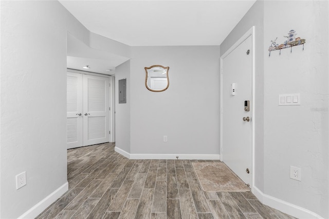 foyer entrance featuring hardwood / wood-style flooring and electric panel