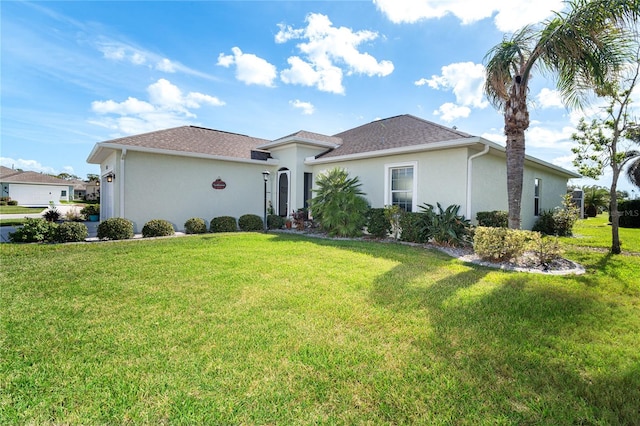 ranch-style home featuring a front yard