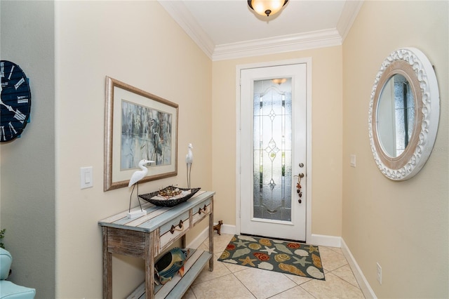 foyer entrance with light tile patterned floors and crown molding