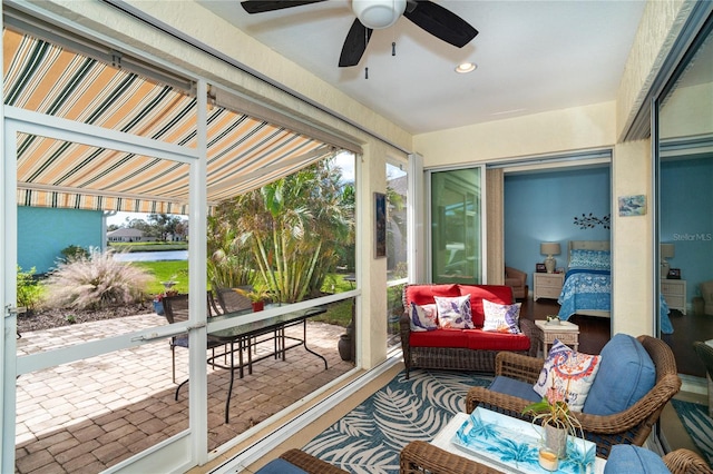 sunroom / solarium with ceiling fan