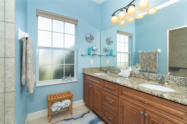 bathroom featuring tile patterned flooring and vanity